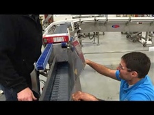Upender Conveyor Solves Carton Orientation prior to Case Packer