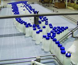 milk jugs on a conveyor