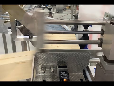 Adjustable Pusher Device Feeds Multiple Carton Shrink Wrapper
