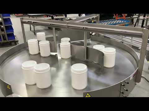 Rotary Unscrambler for Multiple Size Containers with Overhead Adjust