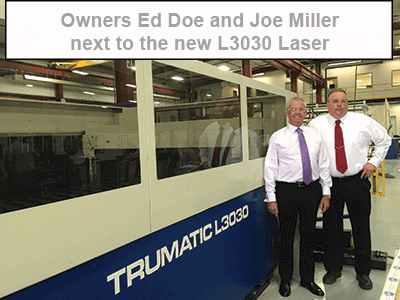 Doe and Miller stand next to laser unit